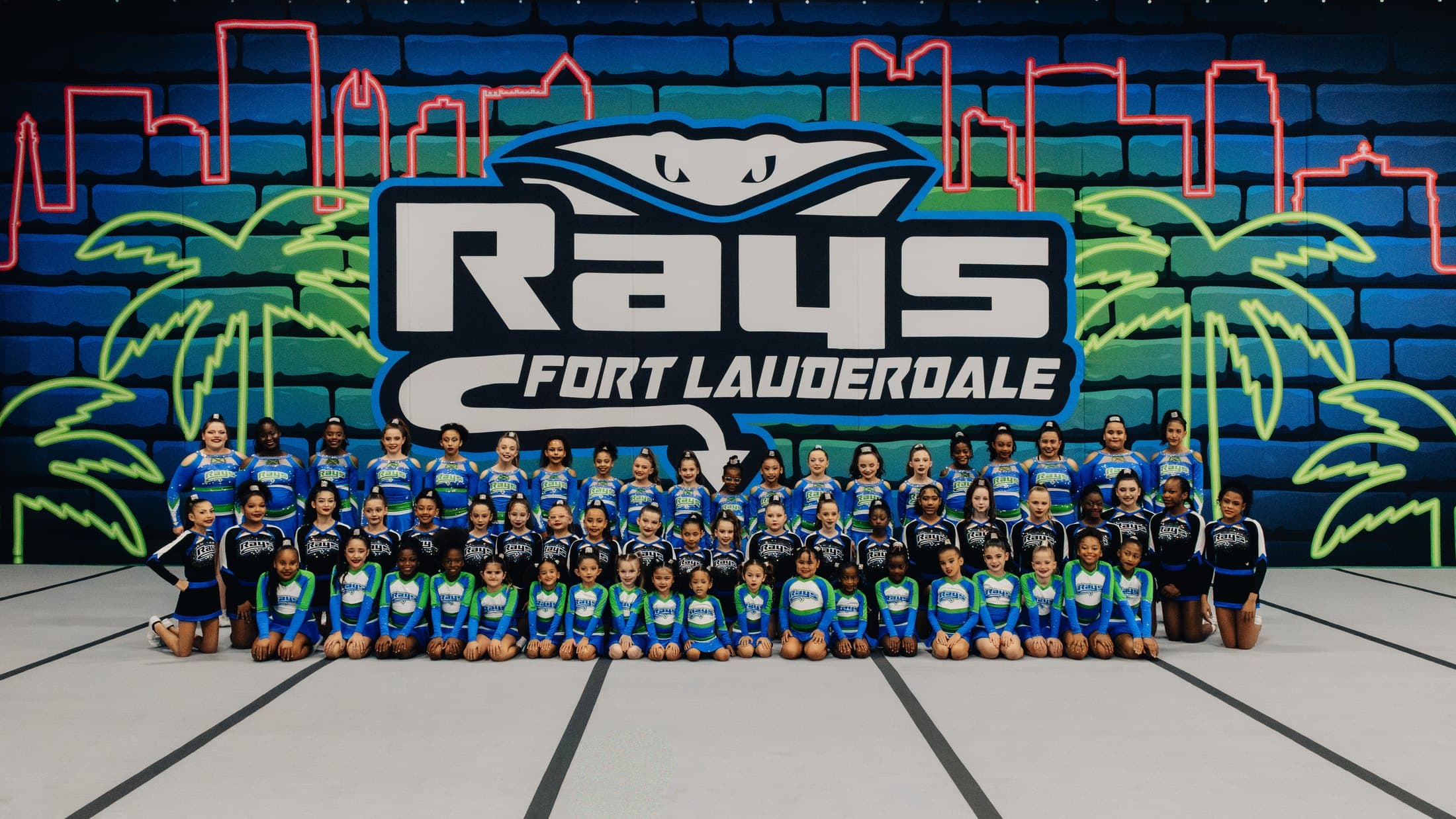 The full Stingray Allstars Fort Lauderdale program in front of the Rays mural wall